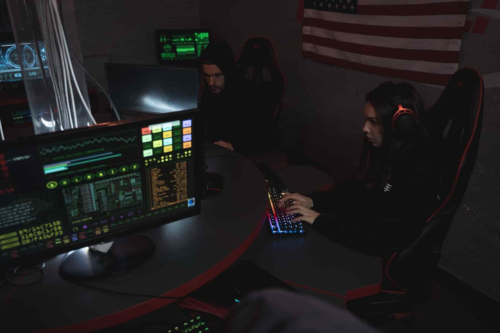 SOC analyst monitoring cybersecurity threats on multiple screens